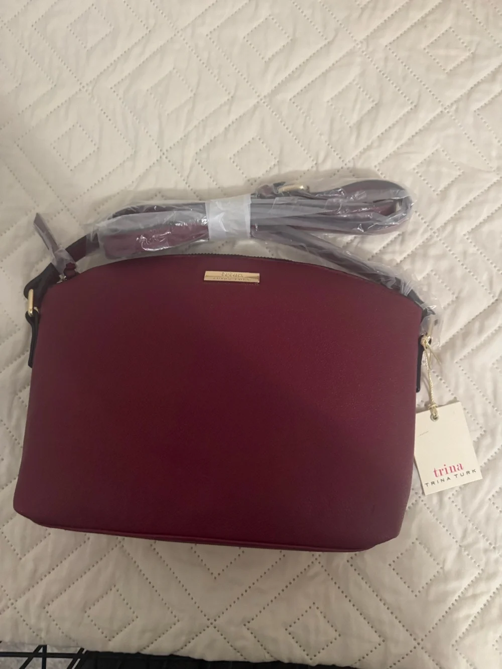 Trina Turk Wine Red Crossbody Bag with Gold Hardware